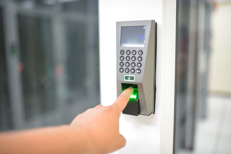 Hand securely unlocking a new front door
